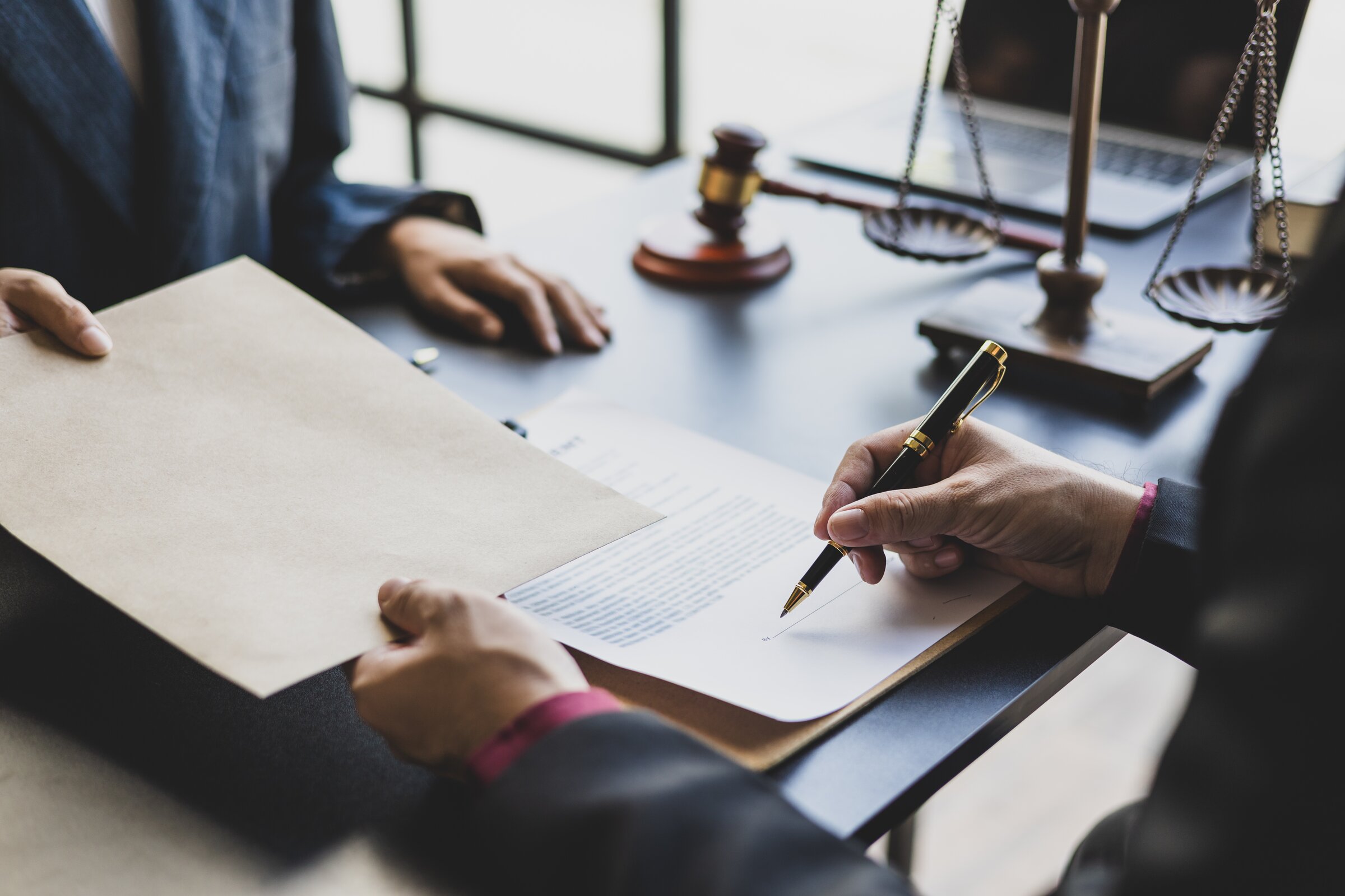 Professional signing business valuation and legal documents